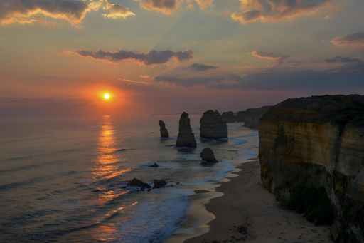 Sunset view of the Twelve Apostles rock formations along the Great Ocean Road in Victoria, Australia