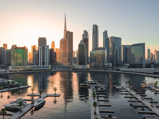 View of Dubai skyline including the Burj Khalifa, the world's tallest skyscraper as seen from Business Bay in Dubai, UAE