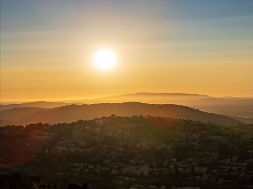 A stunning sunset over a mountainous landscape in Boliqueime, Algarve, Portugal