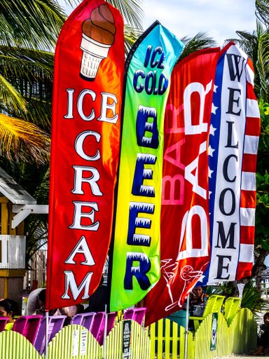 A vertical shot of colorful flag kits with various writings