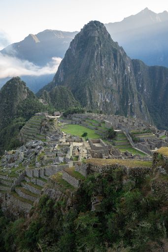 A breathtaking view of Machu Picchu with the iconic Huayna Picchu mountain in the background