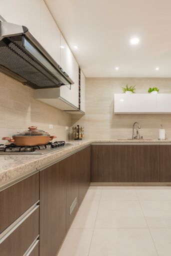 A Countertop and worktop with built-in stove and extractor hood.