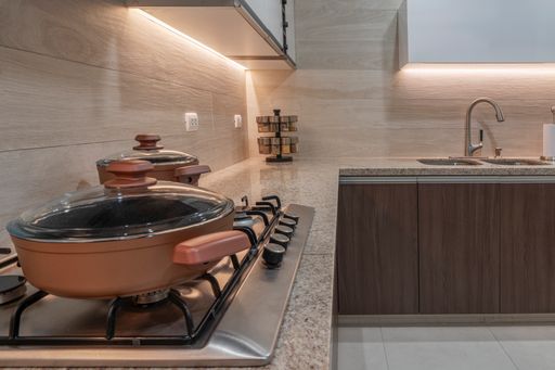 A pot and pans on the kitchen countertop at home