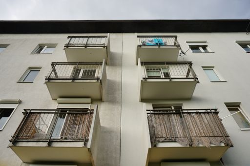 A low angle shot of an apartment with balconies