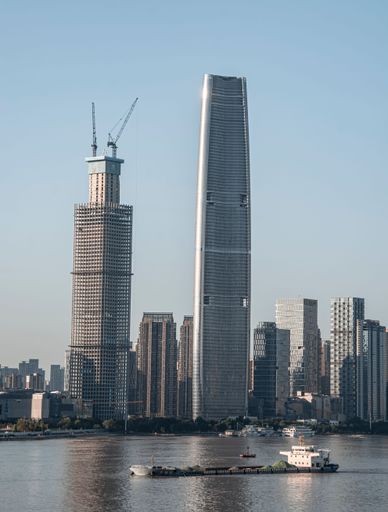 Under a clear sky, the Wuhan Commercial Center is lined with high-rise modern skyscrapers along the Yangtze River. China.