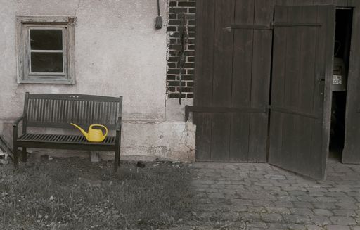 An old bench in front of the house