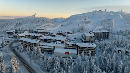Aerial view of the Ruka village, winter sunset in Finland