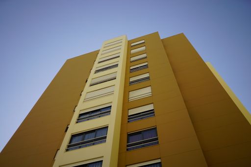 A low angle view of a high-rise residential building in Lisbon, Portugal