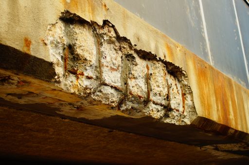 Corrosion damage on a concrete bridge on a busy thoroughfare in Frankfurt. With an age of about 50 years, it has its best days behind it.