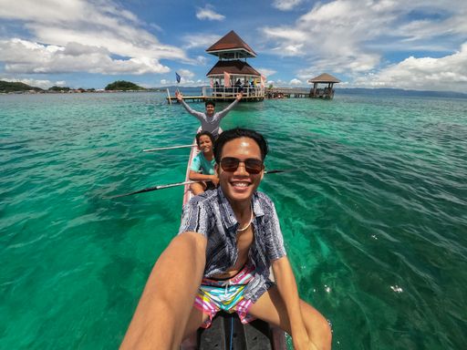 Amazing and Adventure Action Shot of Happy Young Filipino Asian Teenagers Kayaking in the Crystal-clear Turquoise Blue Water Beach in the Philippines