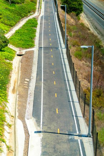 A high angle shot of a path for bikes in the city