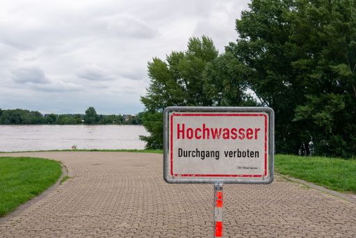 Sign saying flood cloudy day