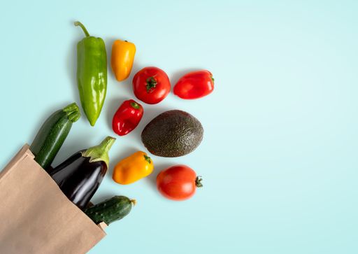 A top view shot of vegetables on a light blue background
