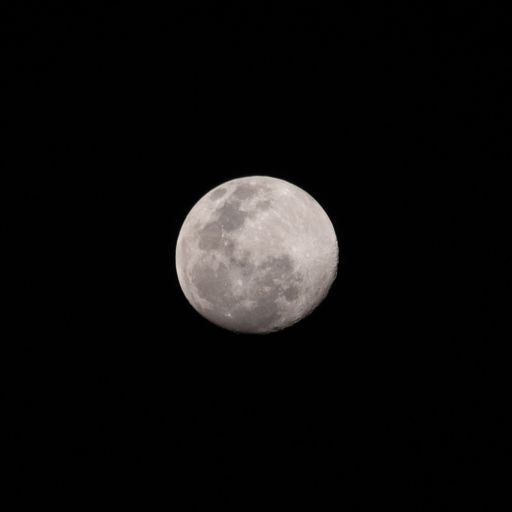 The full moon against a black background at night - perfect for wallpapers and backgrounds