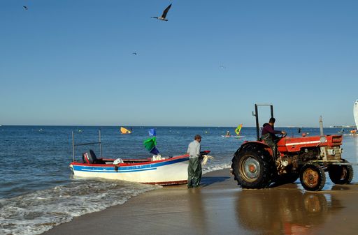 A fisherman at the coast in Islantilla, Spain