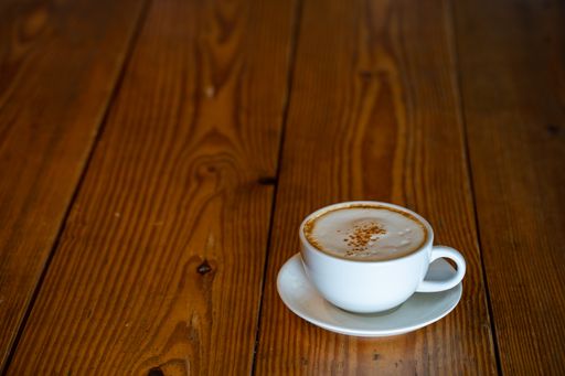 A closeup shot of a morning coffee on a wooden table