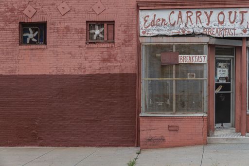Abandoned weathered red brick bakery in Baltimore