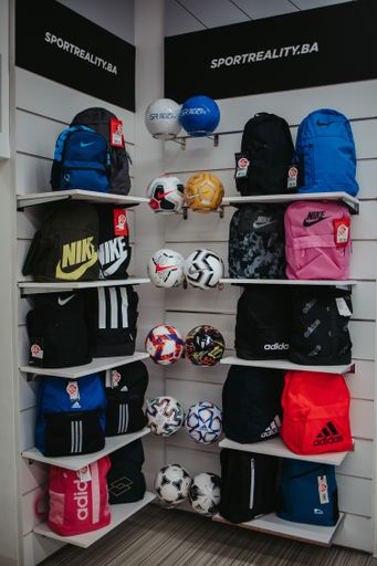 A vertical shot of backpacks. A sports equipment store in Bosnia and Herzegovina.