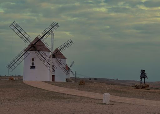 A scenic sunset view of Manchego windmill in Mota del Cuervo, Cuenca, Spain