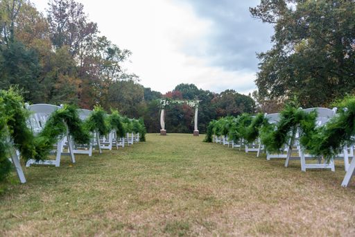 A beautiful outdoor wedding set up surrounded by breathtaking greenery