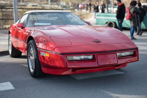 Front view of a classic red fourth-generation Chevrolet Corvette C4 American sports car