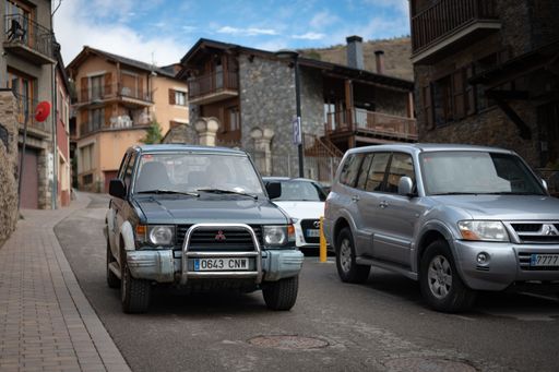 Front view of an old second generation V20 Mitsubishi Montero Pajero off-road vehicle driving through the alleys of a town