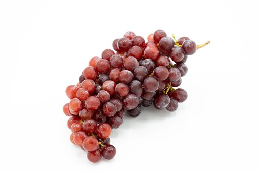 A closeup shot of a bunch of ripe grapes isolated on a white background