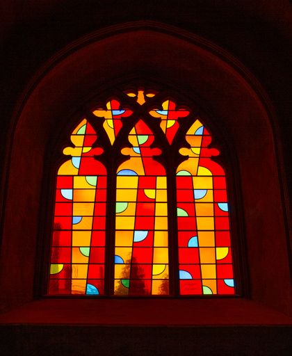 A scenic view of modern stain glass windows in Norwich Cathedral, the United Kingdom