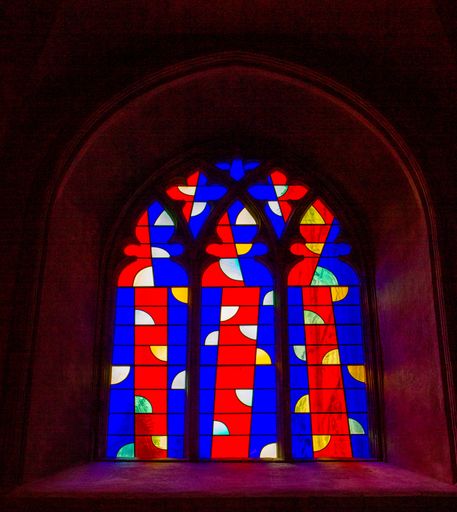 A scenic view of modern stain glass windows in Norwich Cathedral, the United Kingdom