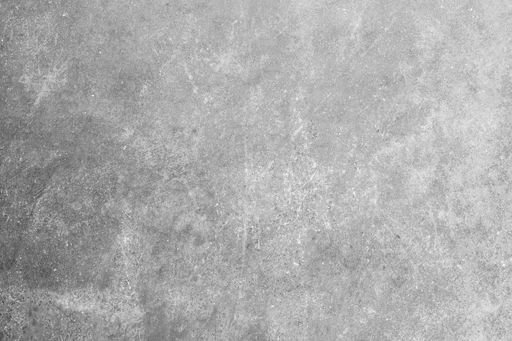 A closeup shot of a rough concrete wall used for wallpaper or background