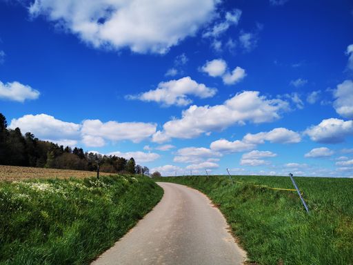 A rural road through the countryside on a sunny day