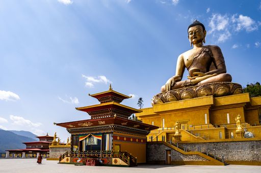 The majestic Buddha Dordenma Statue against the background of a blue sky. Bhutan