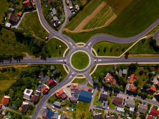 An aerial shot of a roundabout in a rural area
