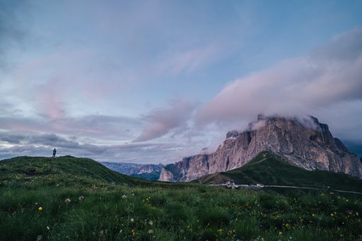 The Sella Group and Sella Towers in the motion blurred clouds. Evening view of high rock walls and towers of Sella group from Sella pass. Clouds and a
