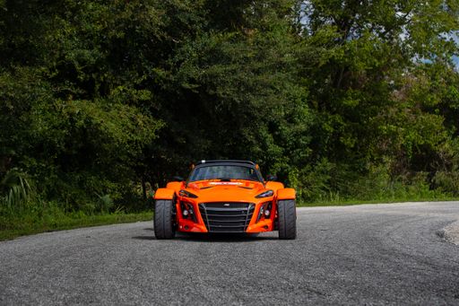 The Donkervoort D8 GT-40 is a high-performance sports car featuring a lightweight, aerodynamic design and a powerful engine, blending speed with sleek
