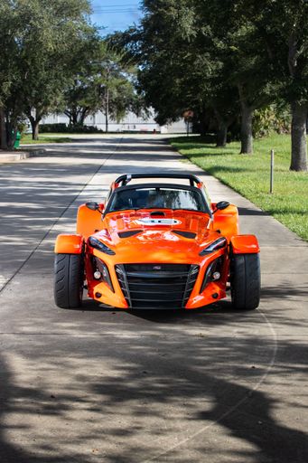 The Donkervoort D8 GT-40 is a high-performance sports car featuring a lightweight, aerodynamic design and a powerful engine, blending speed with sleek