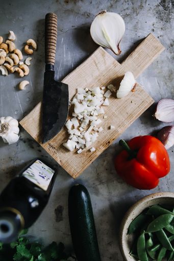 A top view of chopped onion on a wooden board