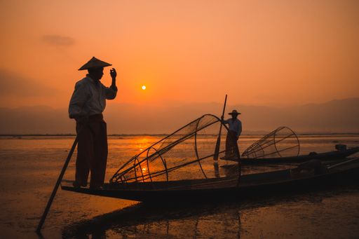 A silhouette of traditional fisherman in Inle Lake near the city of Nyaungshwe, Myanmar