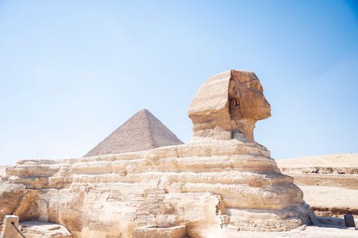 The majestic statue of Sphinx and the Great pyramids in Cairo, Egypt