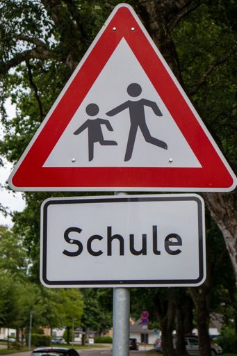 A road sign for children along the school road in Schleswig, Germany