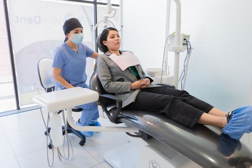 A young woman receiving dental treatment.