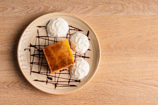 A closeup of delicious carrot cake on a wooden table