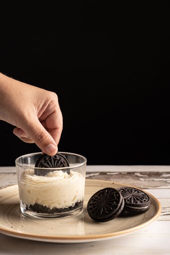 A delicious biscuit with mascarpone on a wooden table