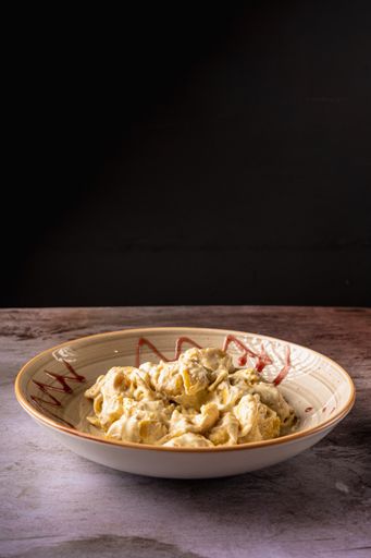 A delicious pear fiocchetti on a wooden table