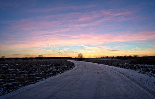 A beautiful shot of a road in a city at sunset