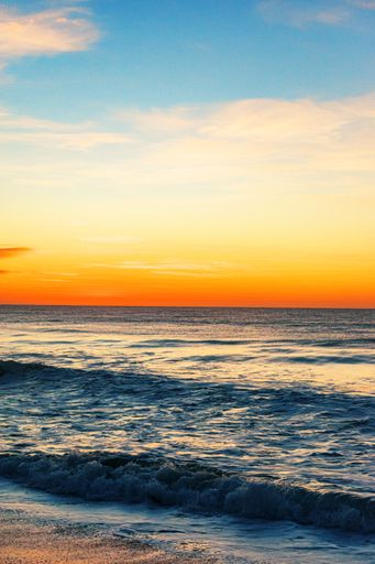 A vertical shot of the North Entrance Beach at sunrise