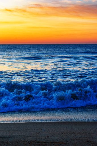 A vertical shot of the waves coming up to the shore at North Entrance Beach