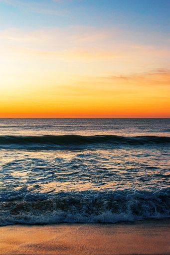A vertical shot of the North Entrance Beach at sunrise
