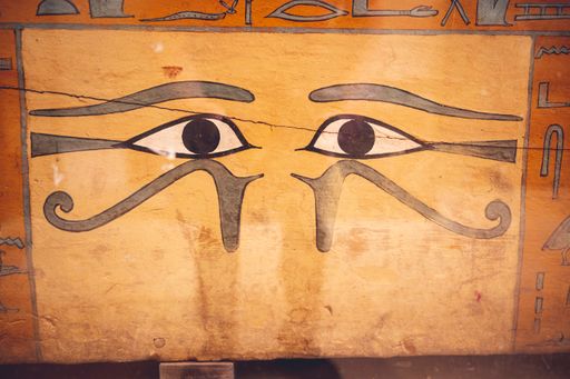 An ancient Egyptian stone surface in the Egyptian Museum in Cairo with the eye of Horus and hieroglyphs on it
