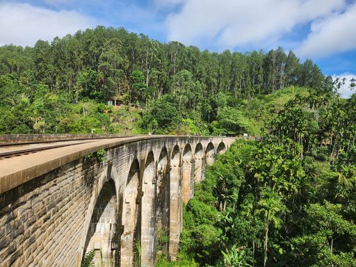 The Nine Arch Bridge is a beautiful and iconic bridge located in Ella, Sri Lanka. It is a popular tourist destination and a great place to take photos